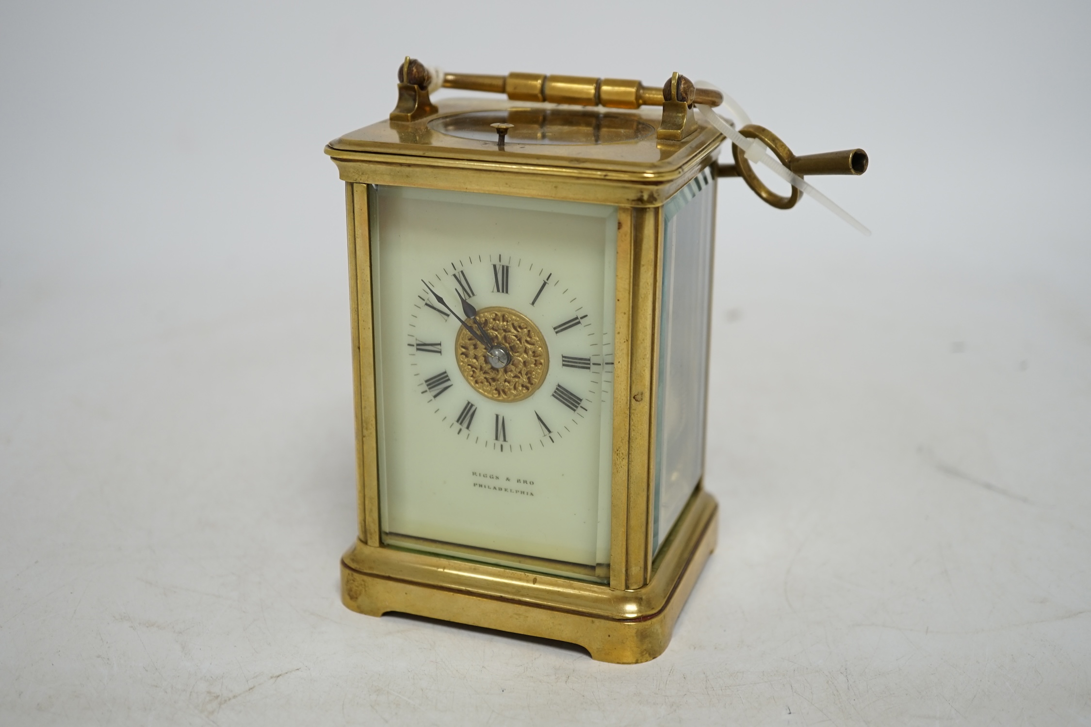 A brass cased repeating carriage clock with key, 14cm. Condition - good, currently ticking